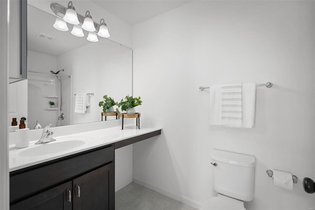 bathroom with vanity, toilet, and walk in shower