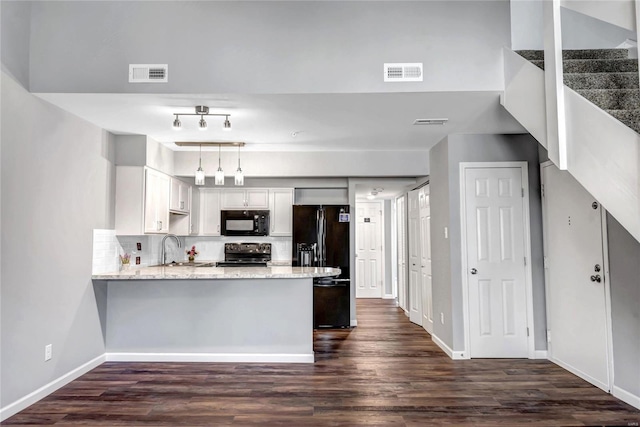 kitchen with sink, white cabinetry, tasteful backsplash, decorative light fixtures, and black appliances