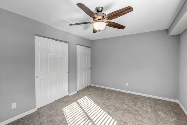 unfurnished bedroom with ceiling fan and light colored carpet