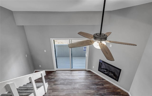 unfurnished living room featuring dark wood-type flooring