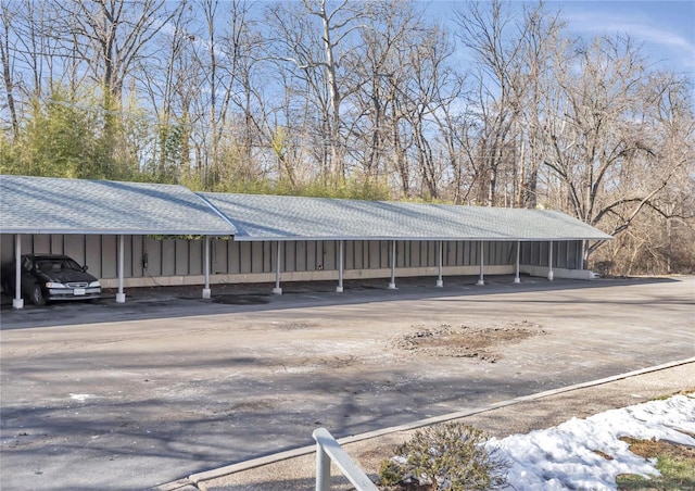 view of parking / parking lot featuring a carport