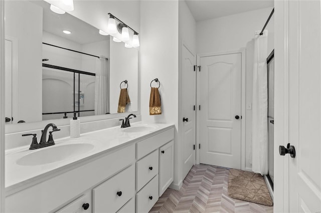 bathroom featuring vanity, parquet flooring, and a shower with curtain