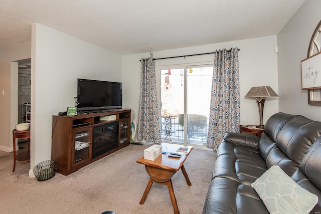 living room with light carpet and a textured ceiling