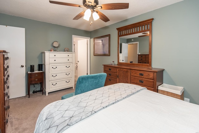 bedroom featuring light colored carpet and ceiling fan