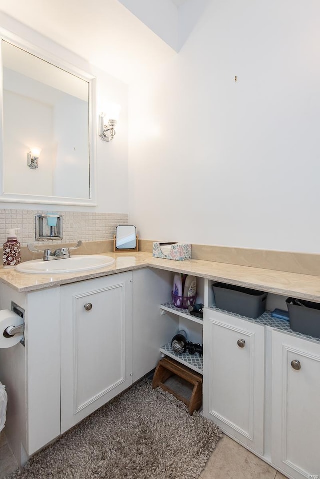 bathroom with vanity and backsplash