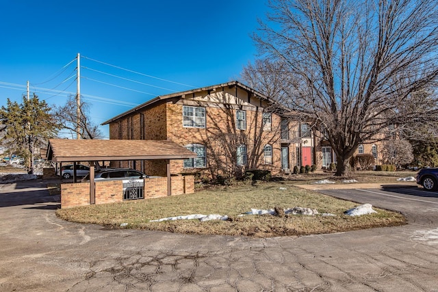 view of front facade with a carport