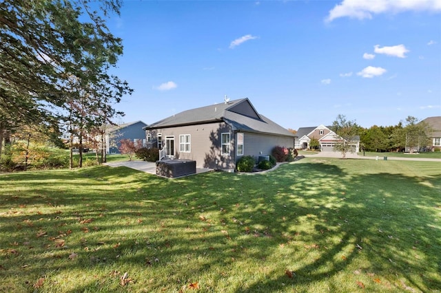 exterior space with a lawn and a patio