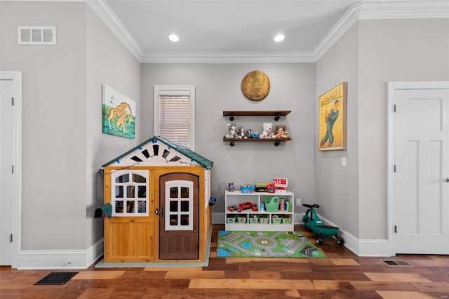 rec room featuring wood-type flooring and ornamental molding