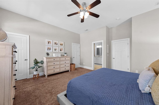 bedroom with ceiling fan, connected bathroom, and carpet floors