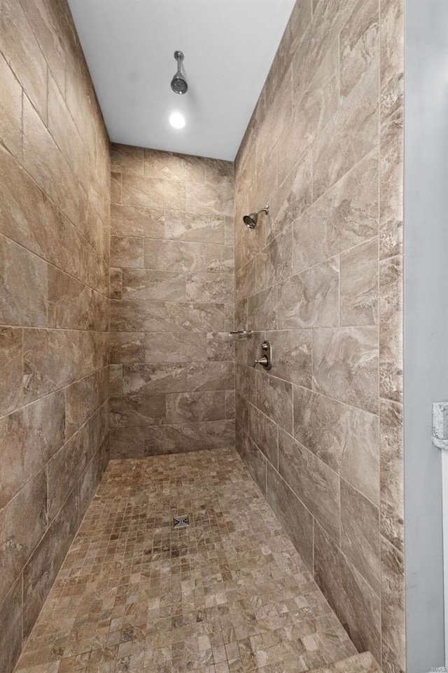 bathroom with a tile shower