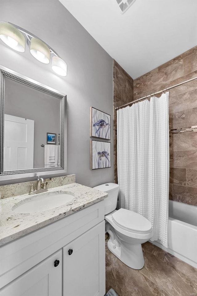 full bathroom featuring vanity, shower / bathtub combination with curtain, and toilet