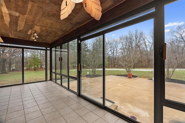 unfurnished sunroom with wooden ceiling