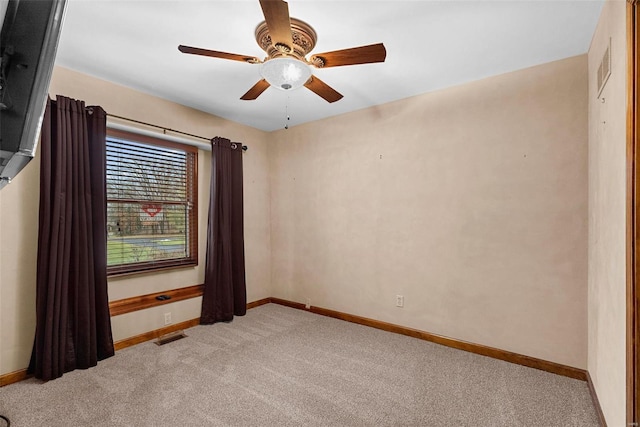 carpeted empty room with ceiling fan