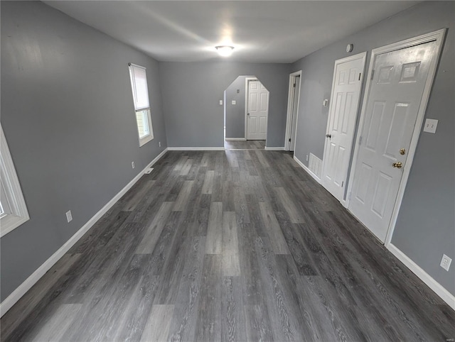 interior space with dark hardwood / wood-style flooring