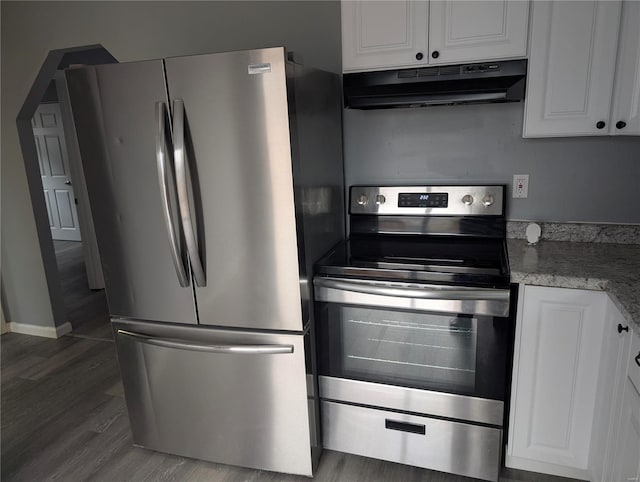 kitchen with white cabinetry, stainless steel appliances, dark hardwood / wood-style flooring, and light stone countertops