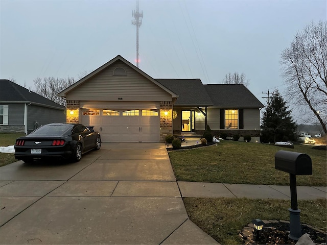 view of front of home with a garage and a front yard