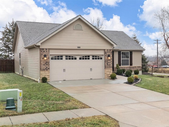 view of front facade featuring a garage and a front lawn