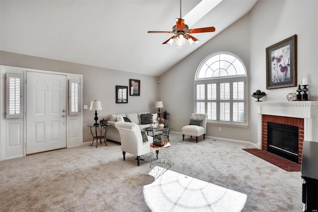 living room with high vaulted ceiling, a fireplace, light colored carpet, and ceiling fan