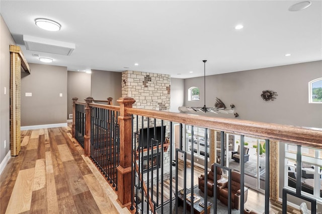 hall with hardwood / wood-style flooring