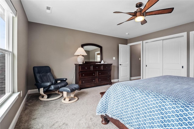 bedroom featuring ceiling fan, carpet flooring, and a closet