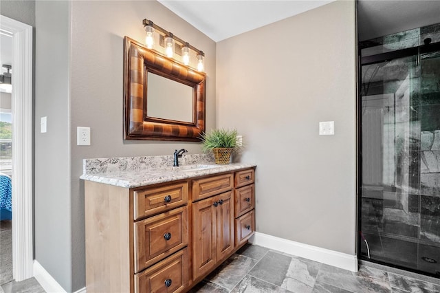 bathroom featuring vanity and a shower with door