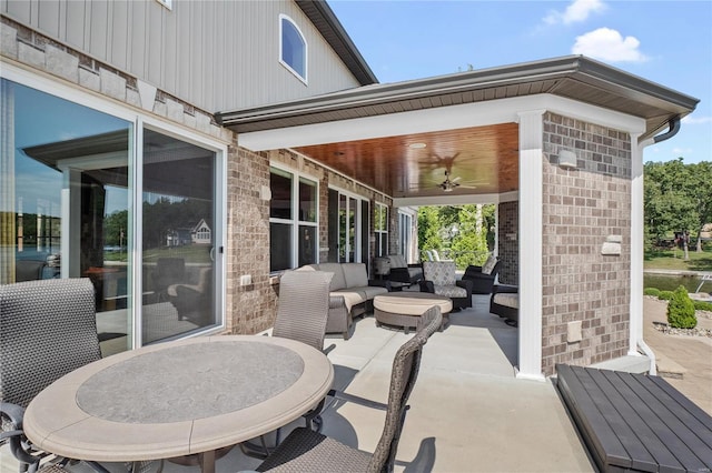 view of patio with ceiling fan and an outdoor hangout area