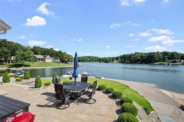 view of patio with a water view