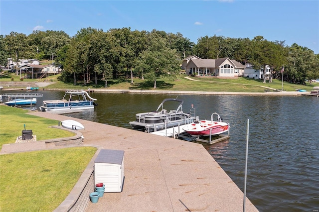 dock area featuring a water view and a lawn