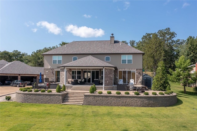 rear view of property featuring a storage shed, a patio, and a lawn