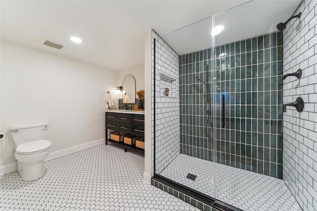 full bathroom featuring toilet, visible vents, vanity, baseboards, and walk in shower