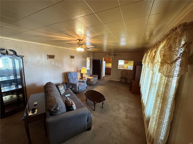 living room featuring ceiling fan and carpet