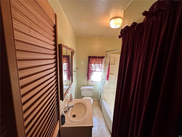 bathroom featuring toilet and sink