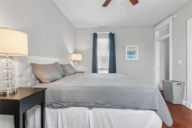 bedroom featuring ceiling fan and dark hardwood / wood-style flooring