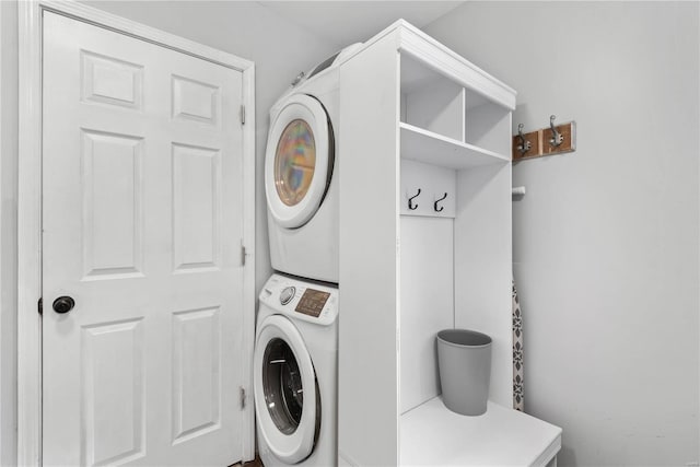 laundry area with stacked washer and dryer