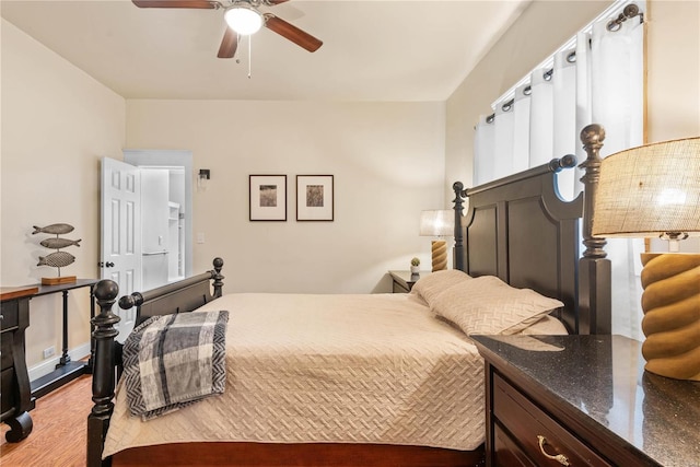 bedroom with ceiling fan and light wood-type flooring