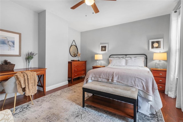 bedroom featuring ceiling fan and dark hardwood / wood-style flooring