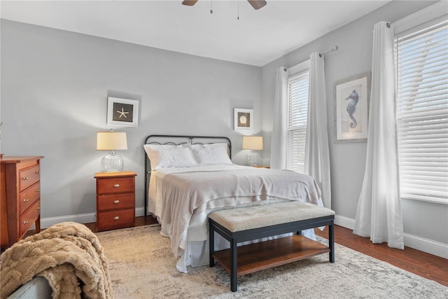 bedroom with wood-type flooring and ceiling fan