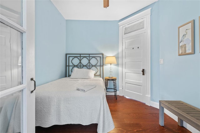 bedroom featuring dark wood-type flooring and ceiling fan