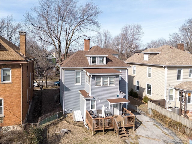 back of house featuring a wooden deck