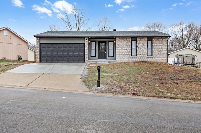 single story home with a garage