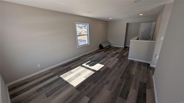 unfurnished room featuring dark wood-type flooring