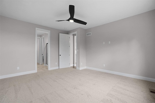 unfurnished bedroom with light colored carpet and ceiling fan