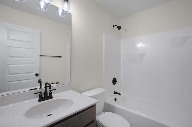 full bathroom with washtub / shower combination, vanity, and toilet