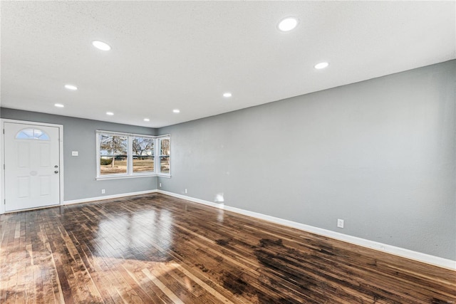 entryway with dark hardwood / wood-style floors