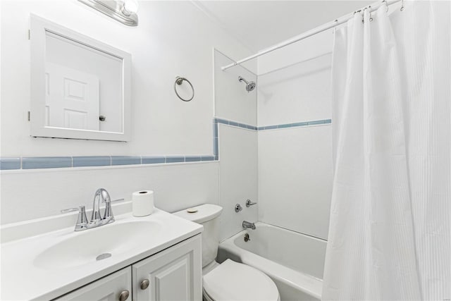 full bathroom with vanity, shower / bath combination with curtain, and toilet