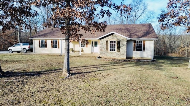 ranch-style home featuring a front yard