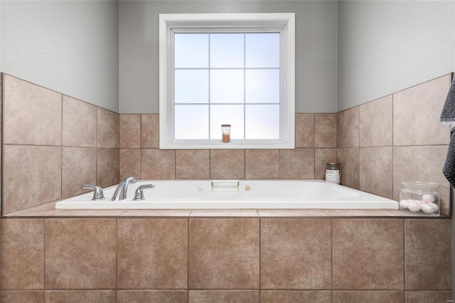 bathroom with tiled bath