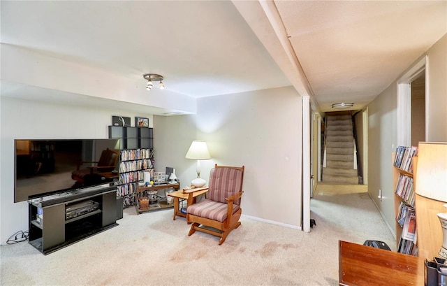 living area featuring carpet flooring