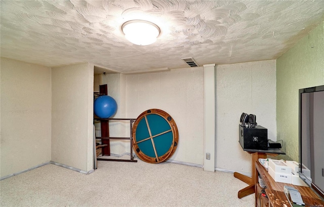 interior space featuring a textured ceiling