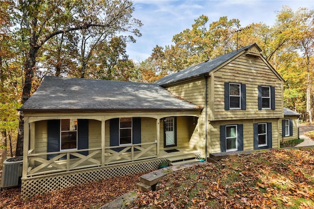 view of front facade featuring cooling unit and covered porch